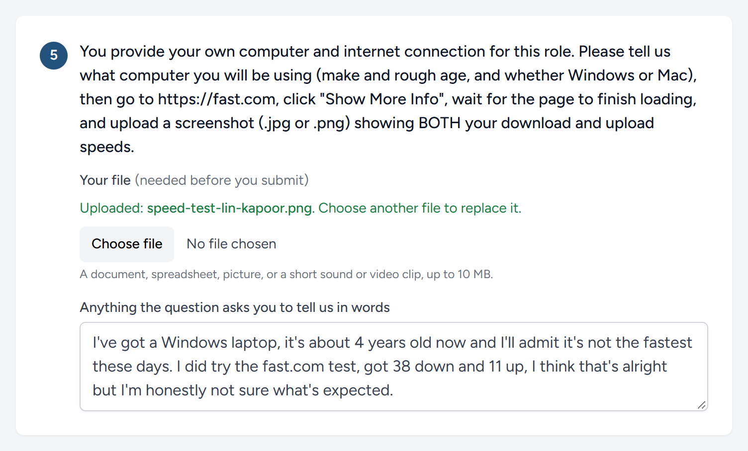 A question that asks for a file, part-way through. The candidate has attached a picture and begun to write.